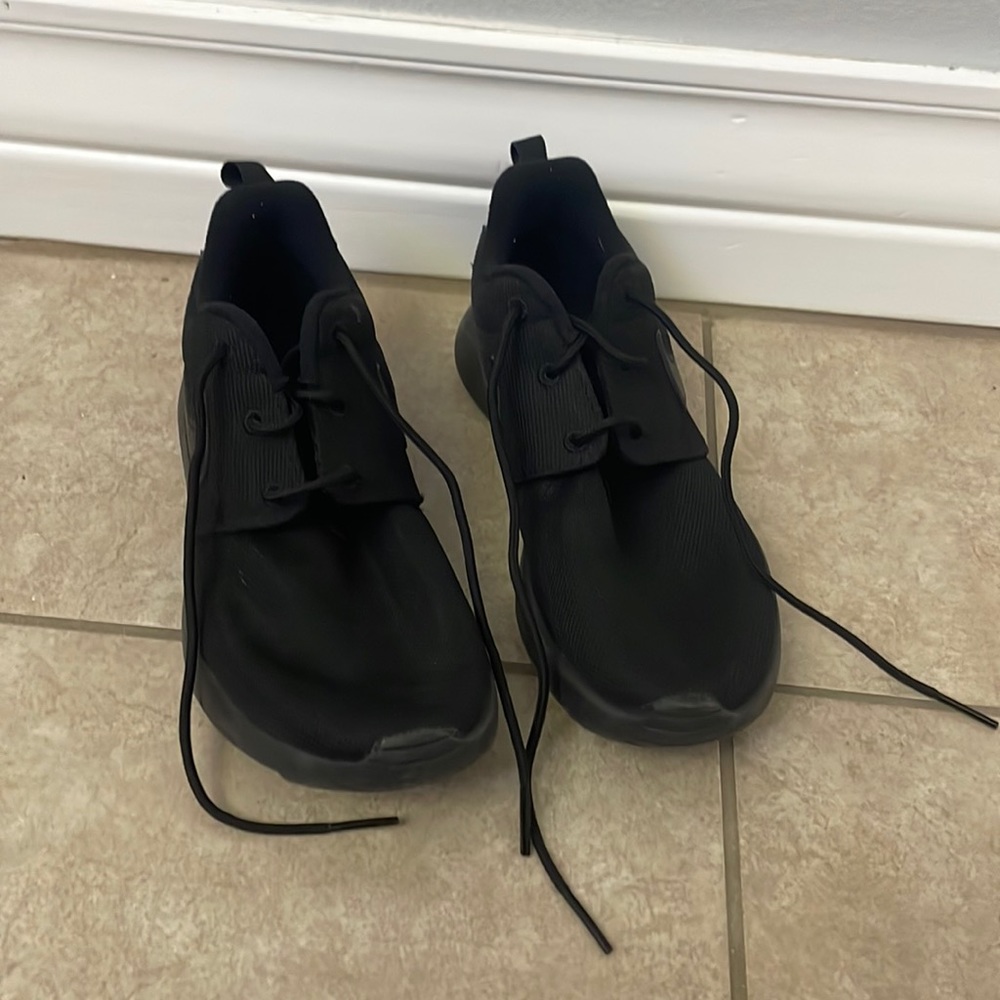 These are black Nike shoes